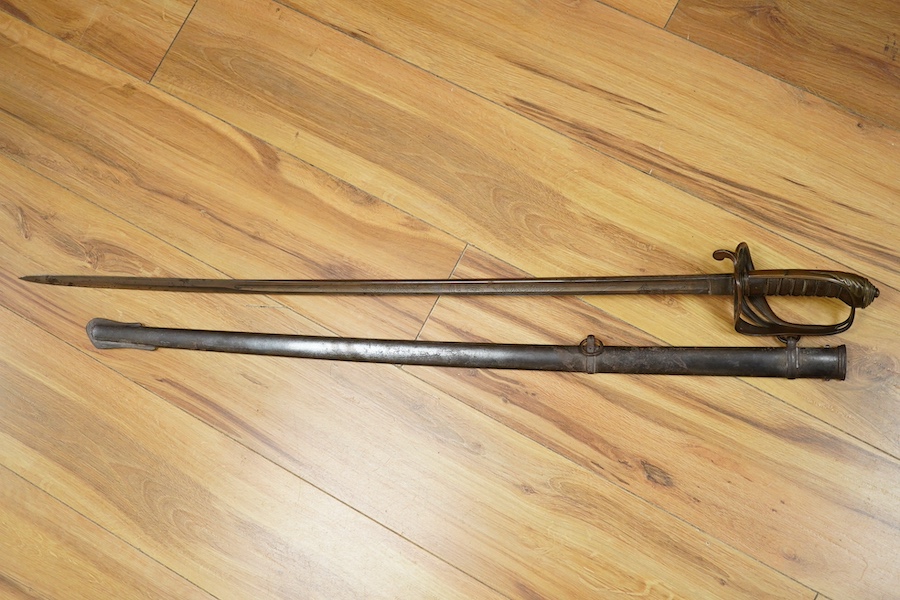 An 1845 pattern infantry officer’s sword by Henry Wilkinson, number 19387, regulation hilt, (fish skin covering missing), in its iron scabbard. Condition - fair to good.